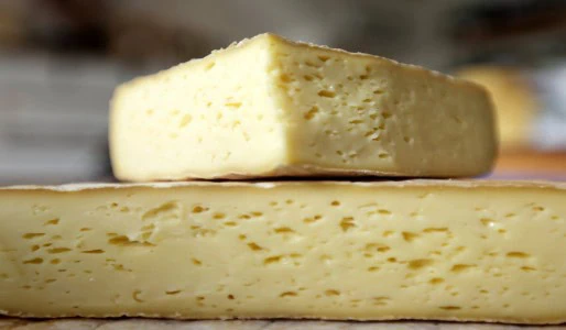 An image of two stacked cheeses from the documentary series Bia Dúchais, Programme 6 Cáis © Marmalade Films Ltd
