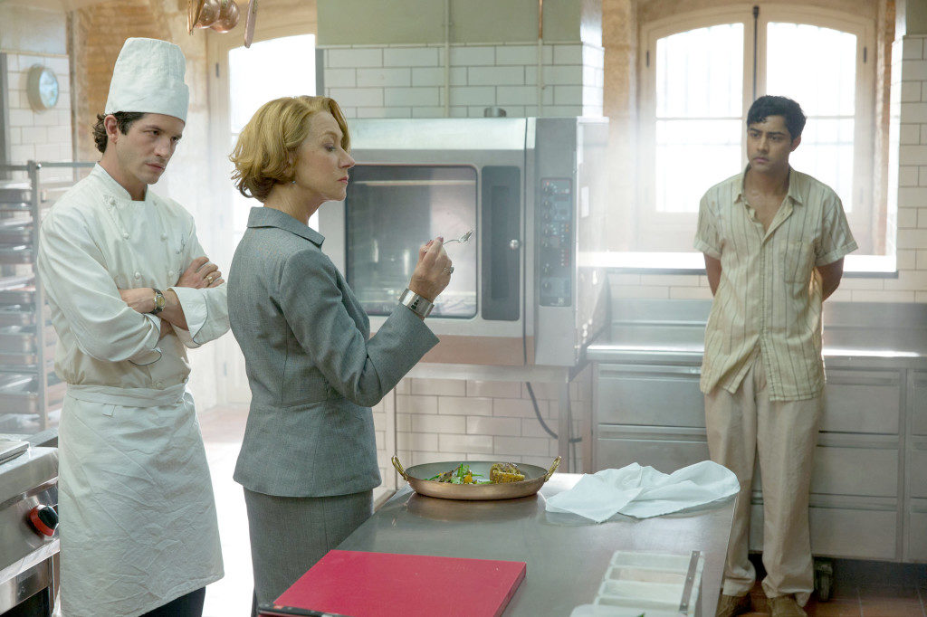 HFJ-0073 

Hassan Kadam (Manish Dayal, right) endures Madame Mallory’s (Academy Award®-winner Helen Mirren) scrutiny of his culinary work, as chef Jean Pierre (Clemént Sibony) looks on, in DreamWorks Pictures’ charming film, “The Hundred-Foot Journey.” Based on the novel “The Hundred-Foot Journey” by Richard C. Morais, the film is directed by Lasse Hallström. The producers are Steven Spielberg, Oprah Winfrey and Juliet Blake. Photo: François Duhamel 

©2014 DreamWorks II Distribution Co., LLC. All Rights Reserved.